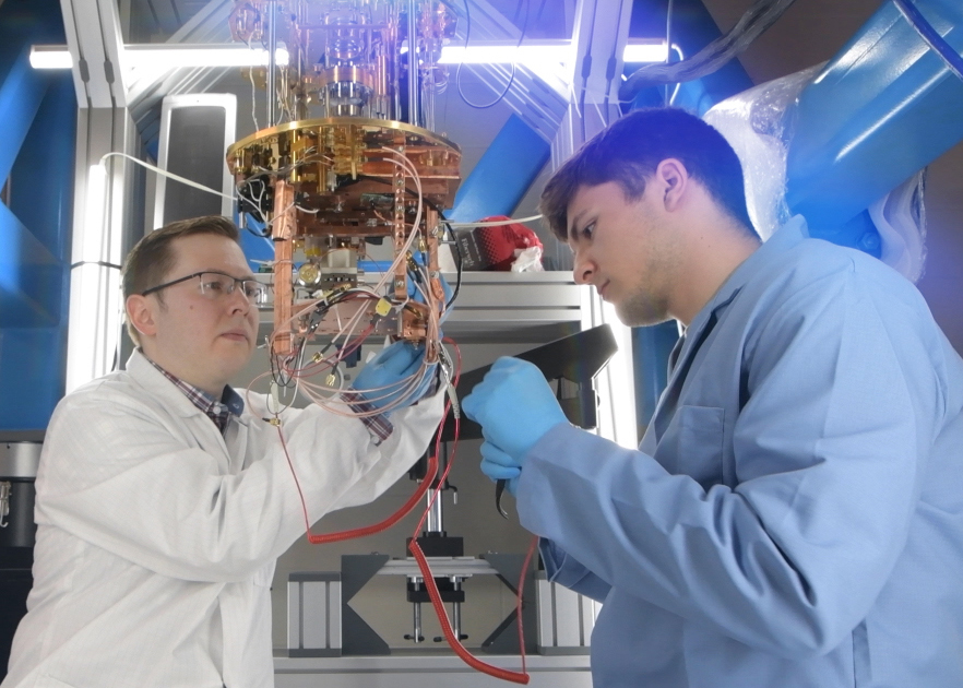 Ilya Sochnikov and a graduate student work on quantum research